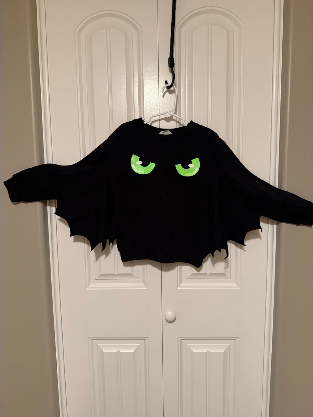 H&M Black Bat Wing Sweatshirt with Neon Green Eyes